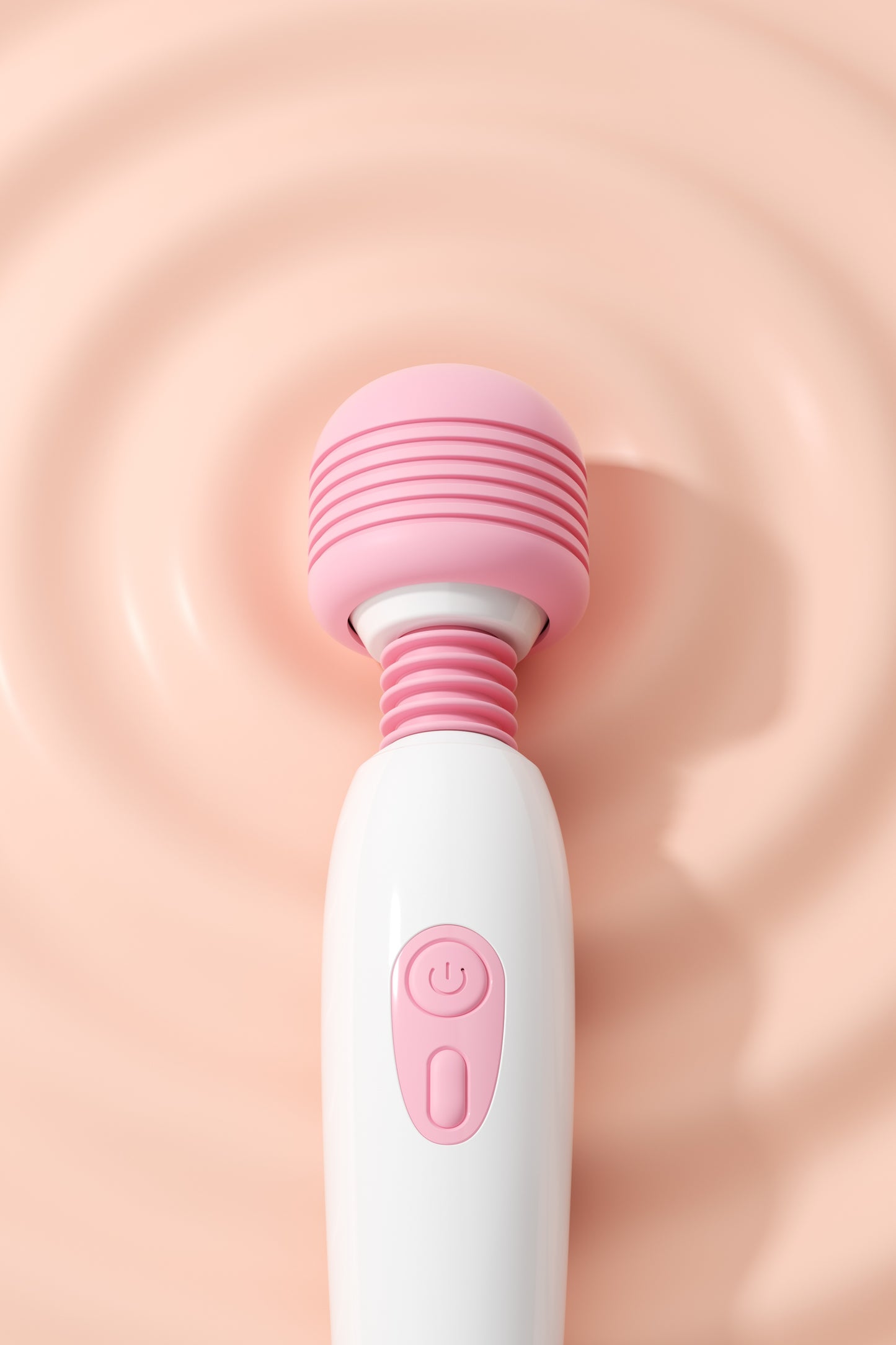 Close-up of power button on pink wand vibrator – Velalace