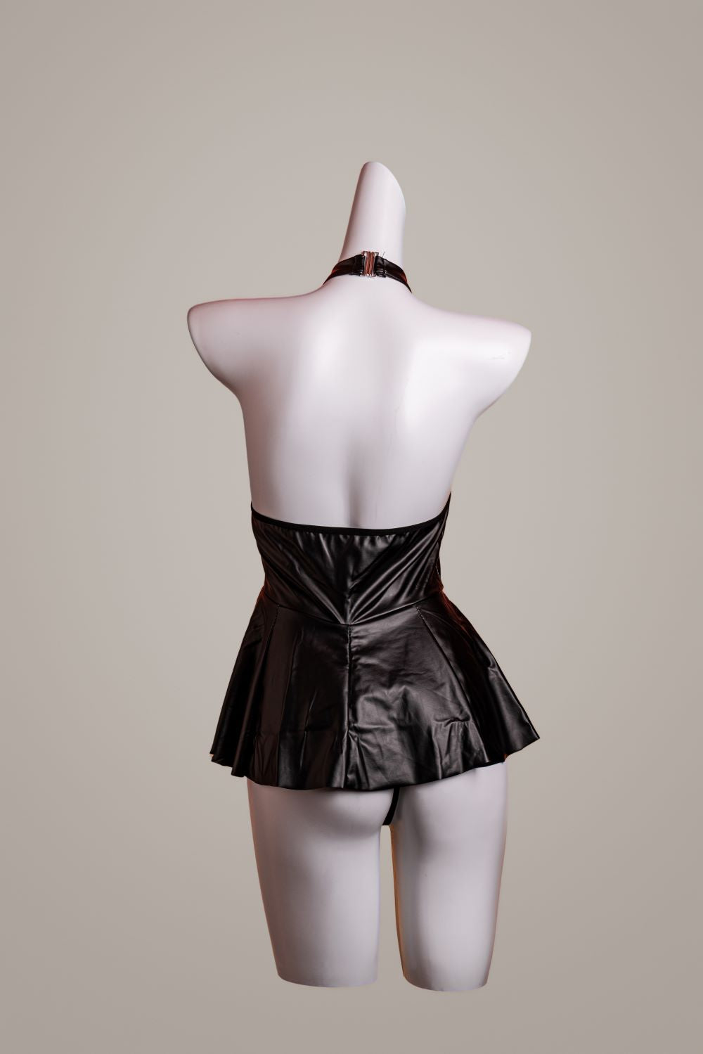 Leather jumpsuit – back view showing straps, cutouts, or lace panels – Velalace