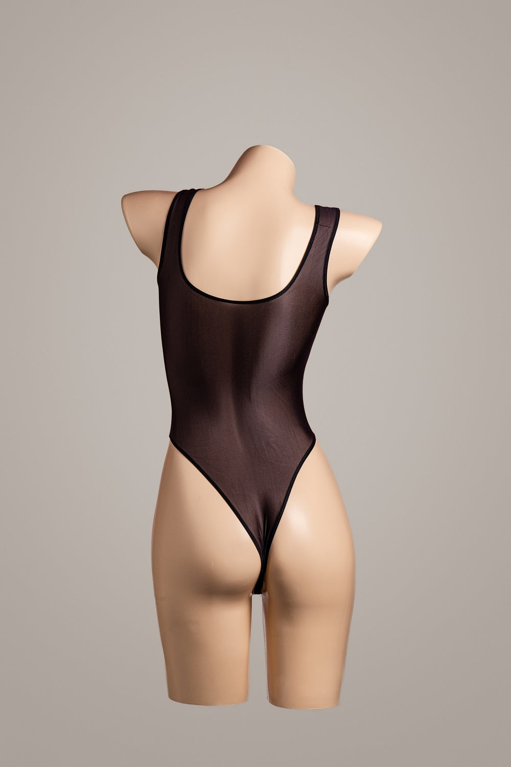 Oily open gear jumpsuit – rear view showing straps, cutouts or lace details – Velalace