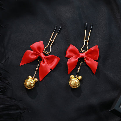 Model wearing red bell nipple clamps with adjustable pressure – Velalace